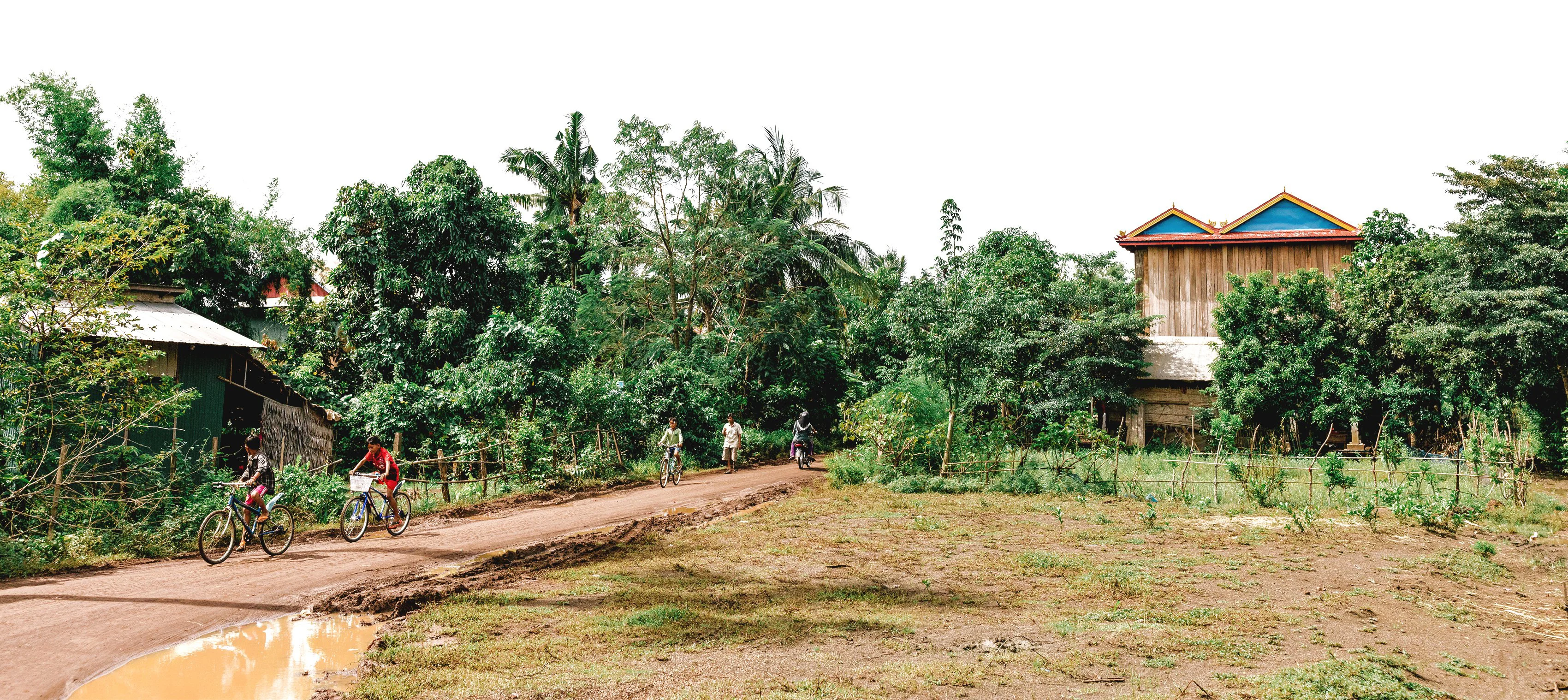 Children ride bicycles in Cambodia